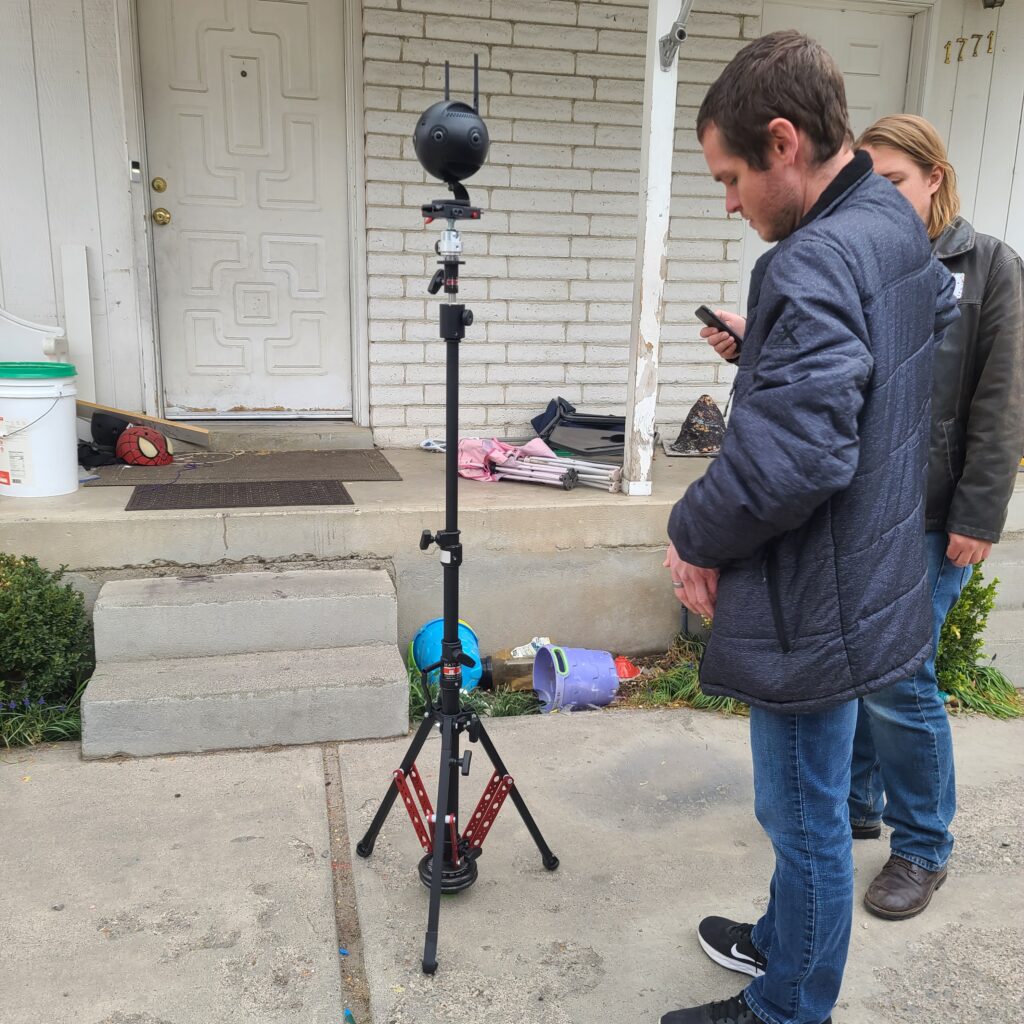 Videographers doing a VR shoot on a family's porch.